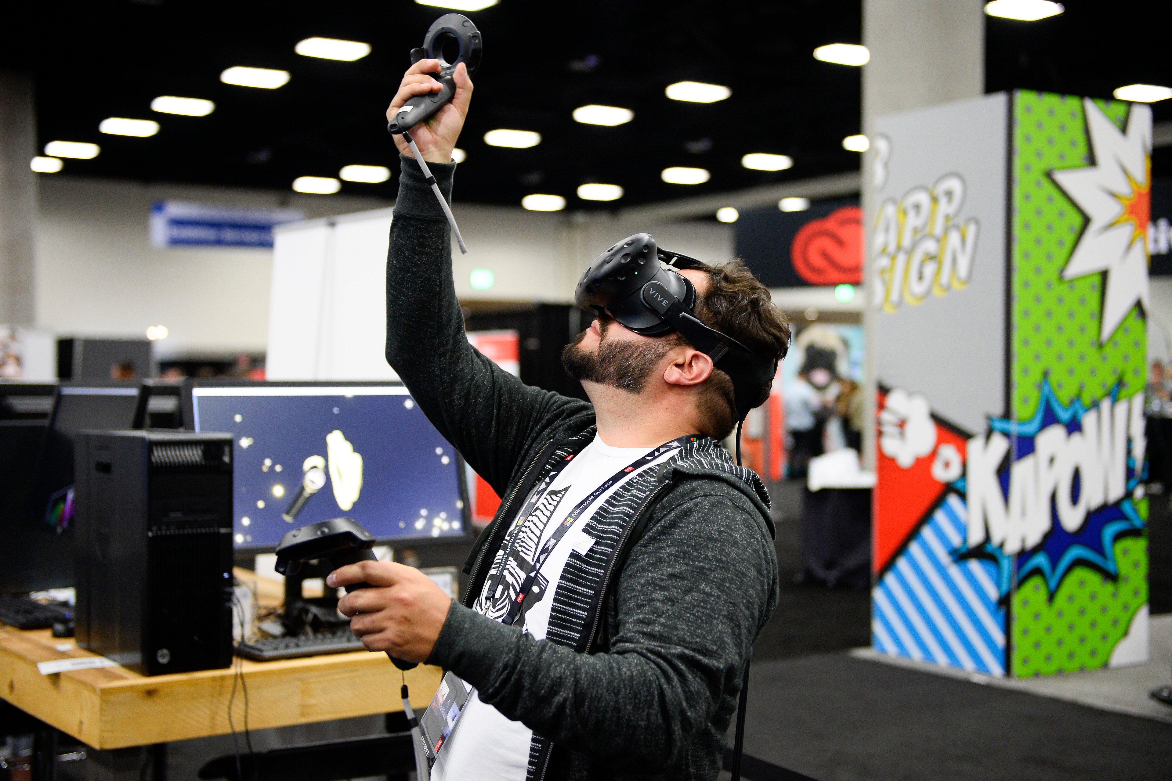A man wearing a virtual-reality headset looks overhead.