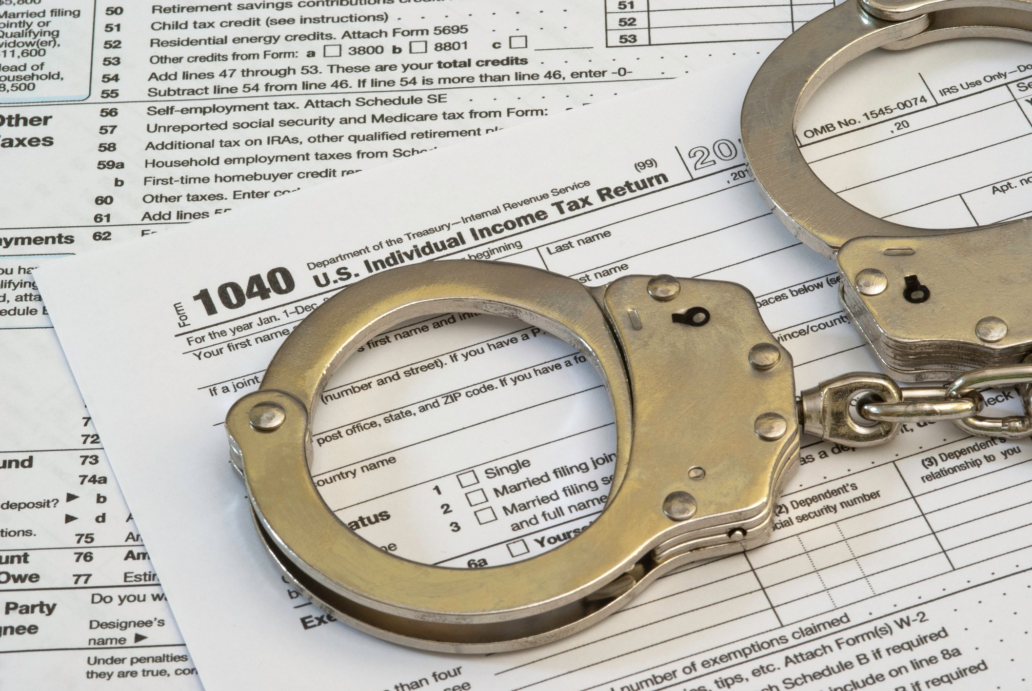 Tax return with handcuffs