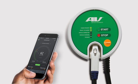 Aerovironment charger next to smartphone showing the app that controls charging.