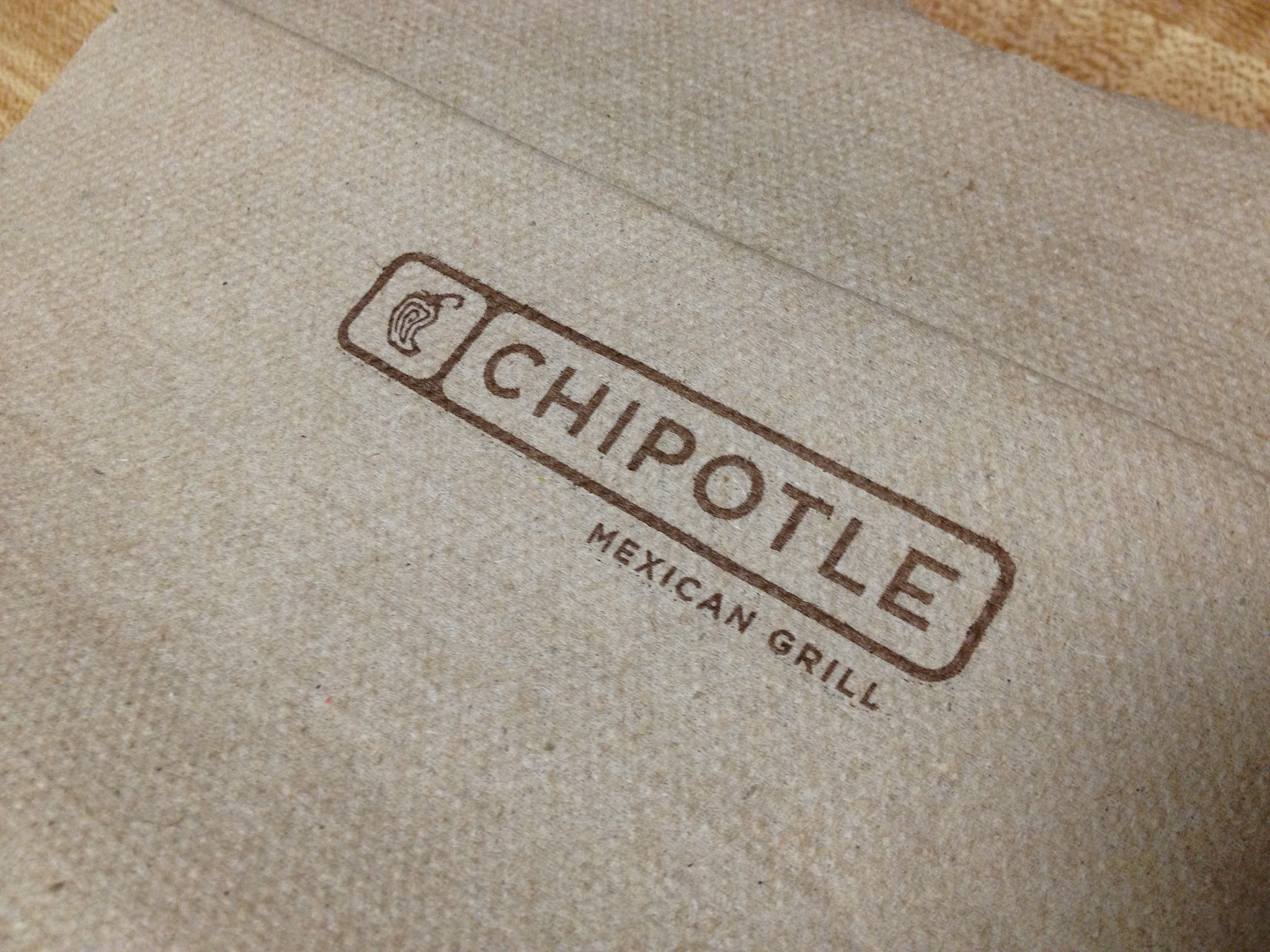 A napkin with the Chipotle logo on it