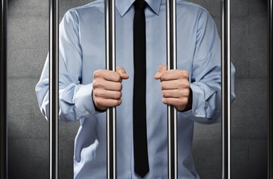 businessman in jail_GettyImages-147533404