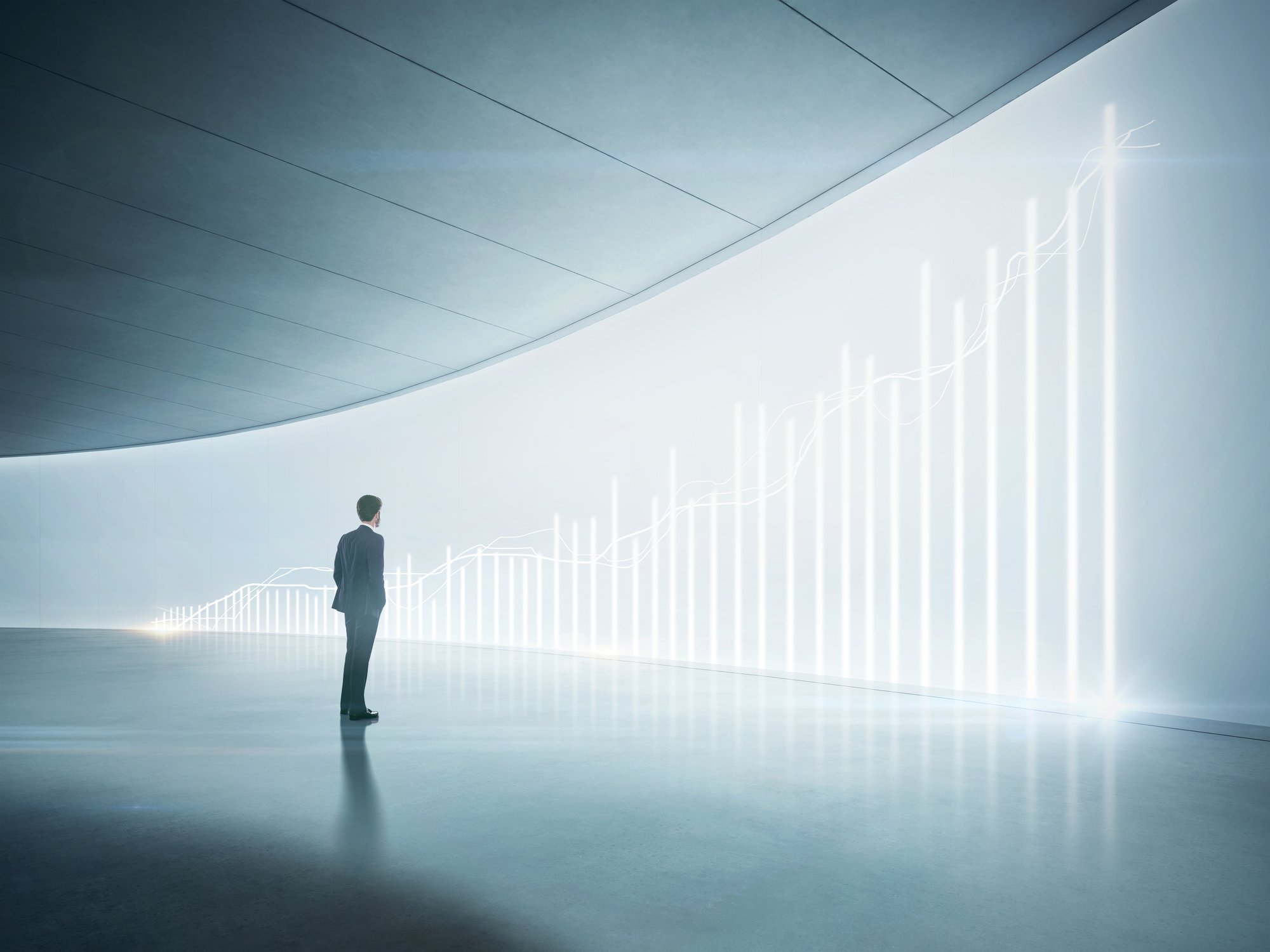 Broker looking at big picture of stock chart.