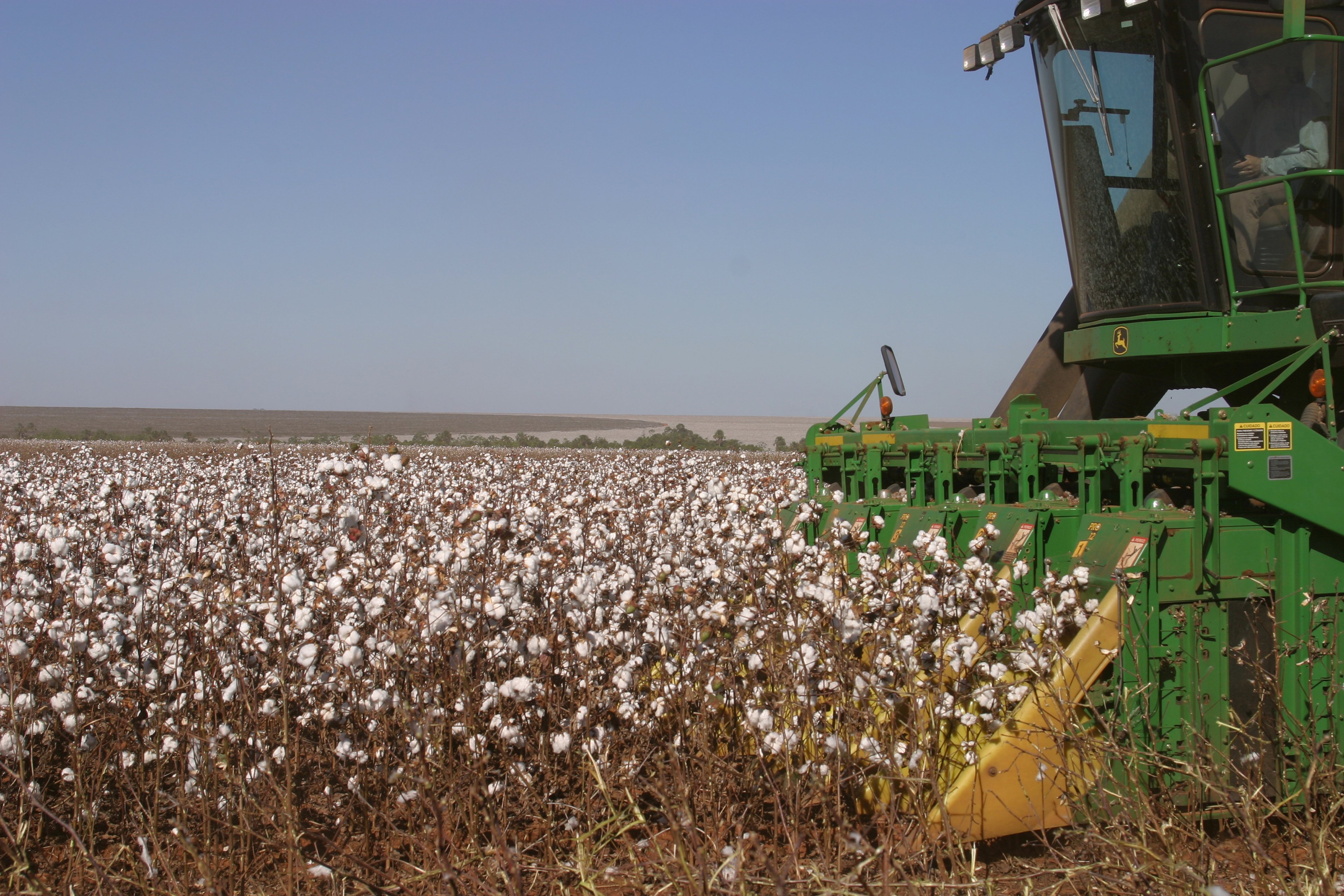 A tractor harvesting crops.