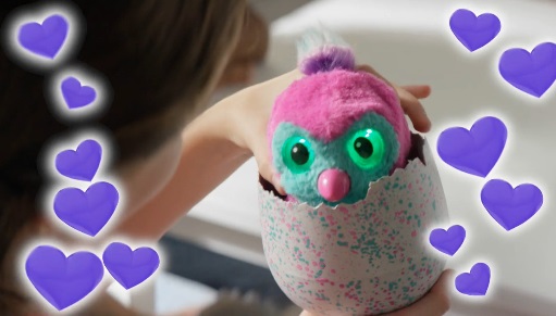 A Hatchimals toy coming out of an egg. 