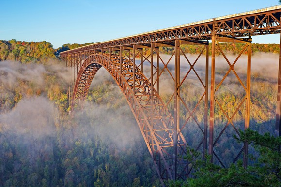 West Virginia bridge with fog beginning to lift in the morning.