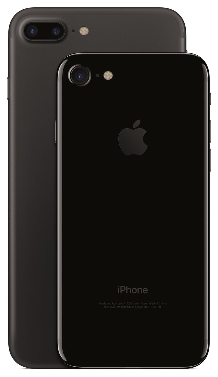 Apple's iPhone 7 Plus in gray at the back, with the iPhone 7 in Jet Black in the forefront. 