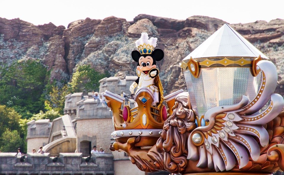 Mickey Mouse rides atop a float.