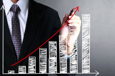 Generic Investing Man in Suit Drawing a Chart