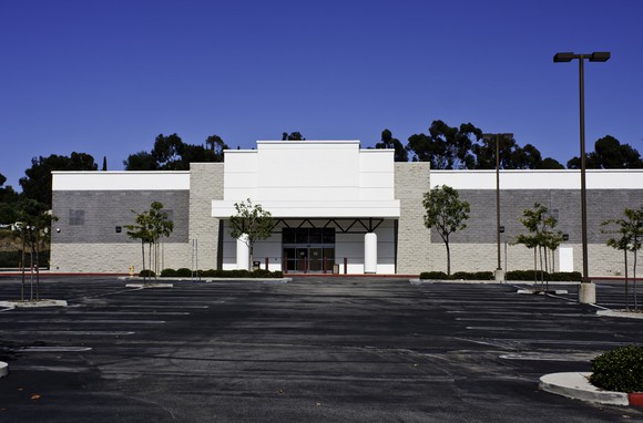 Image of abandoned retail building.