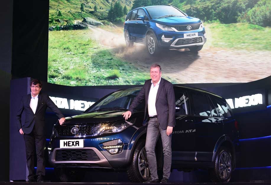 Tata Motors' Hexa, a small SUV, is shown at an auto show by company executives.