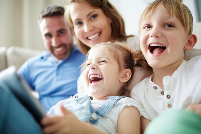 Parents with two kids laughing