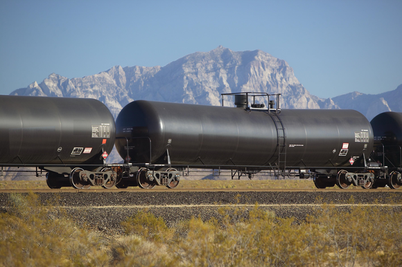 Tank car with mountain backdrop.