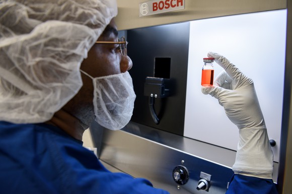 Scientist holding bottle of Glybera