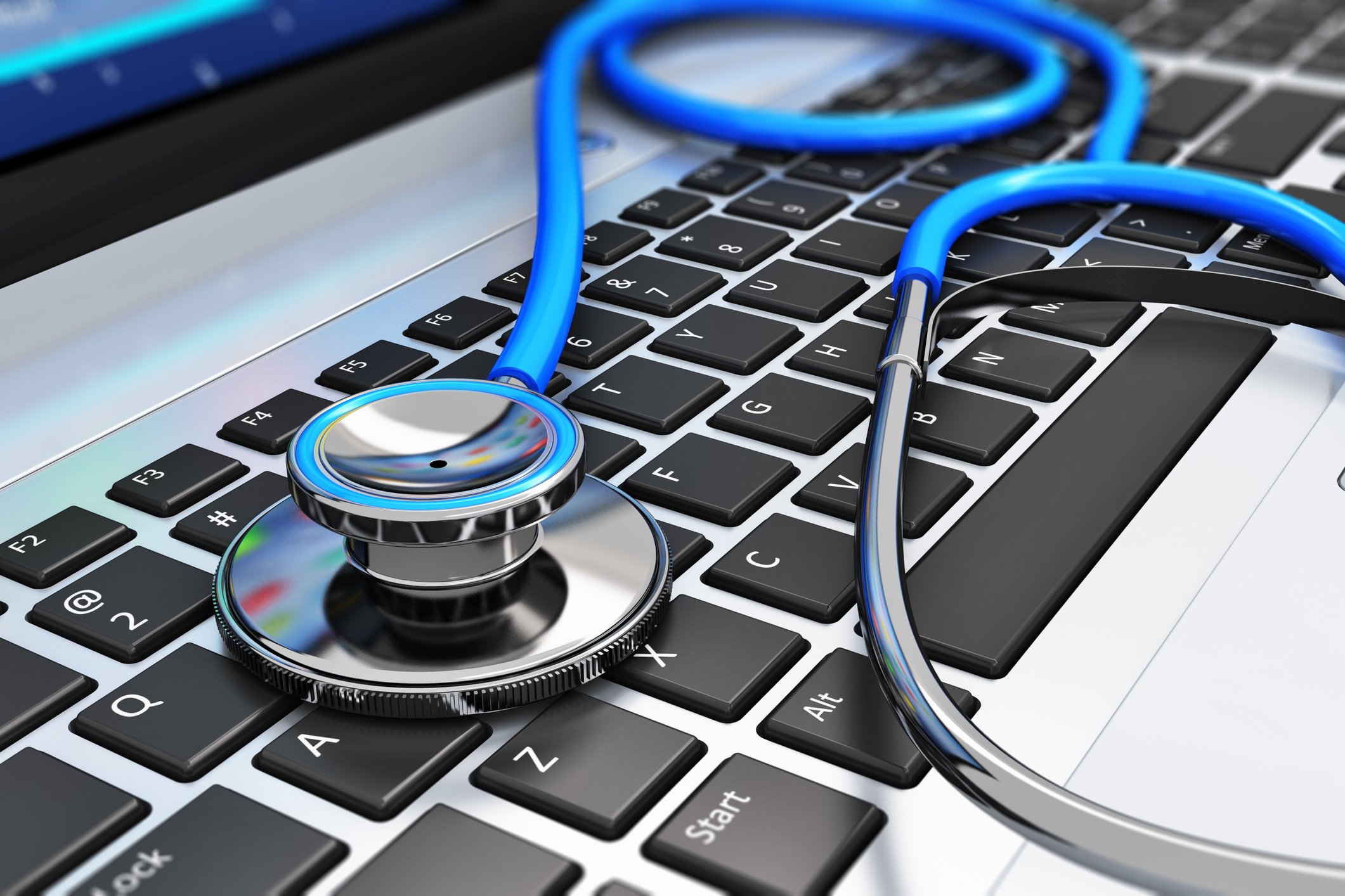 A stethoscope sitting on a keyboard.