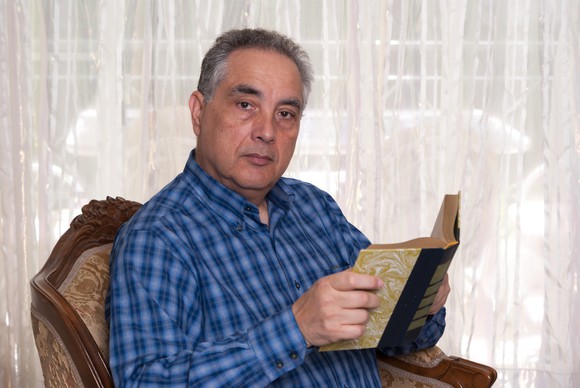 Older man reading a book