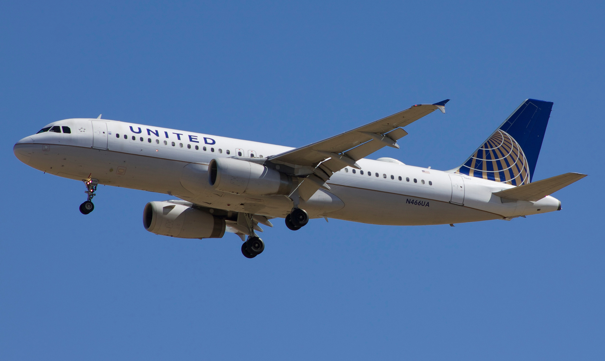 A United Airlines plane in the air.