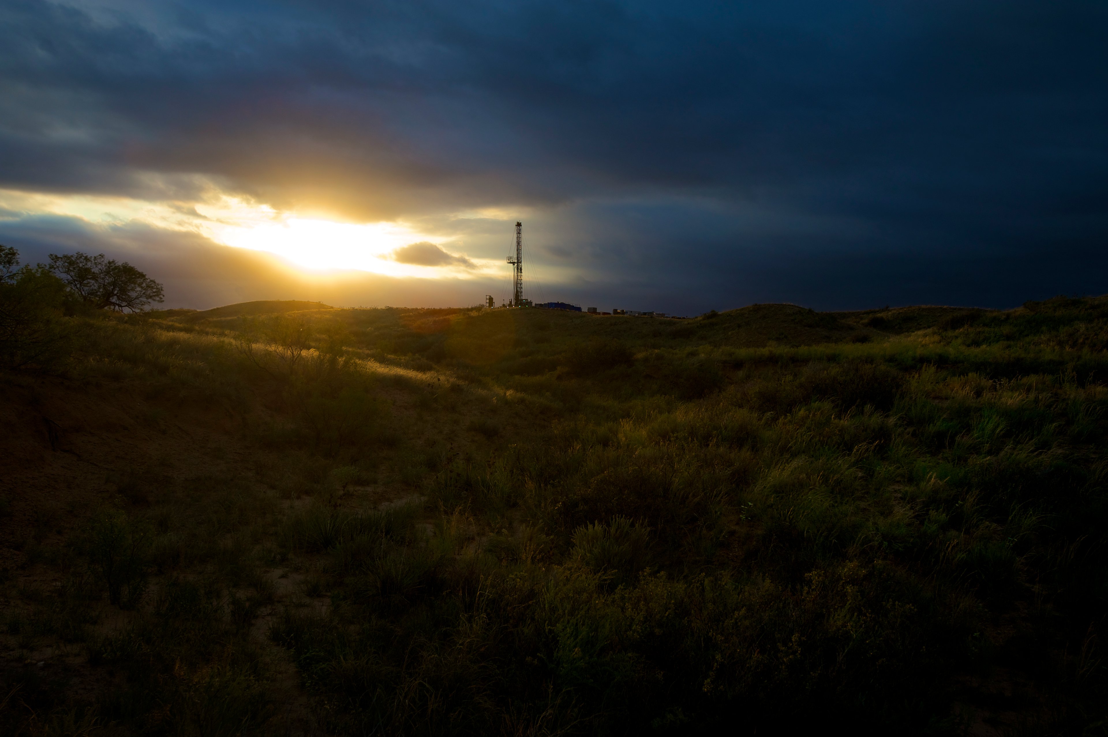A drilling rig at sunset. 