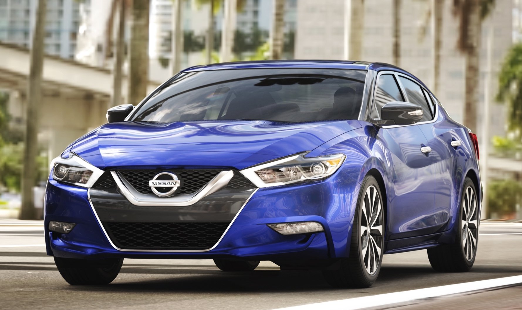 A blue Nissan Maxima sedan