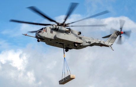 CH-53K helicopter lifting supply pallet.