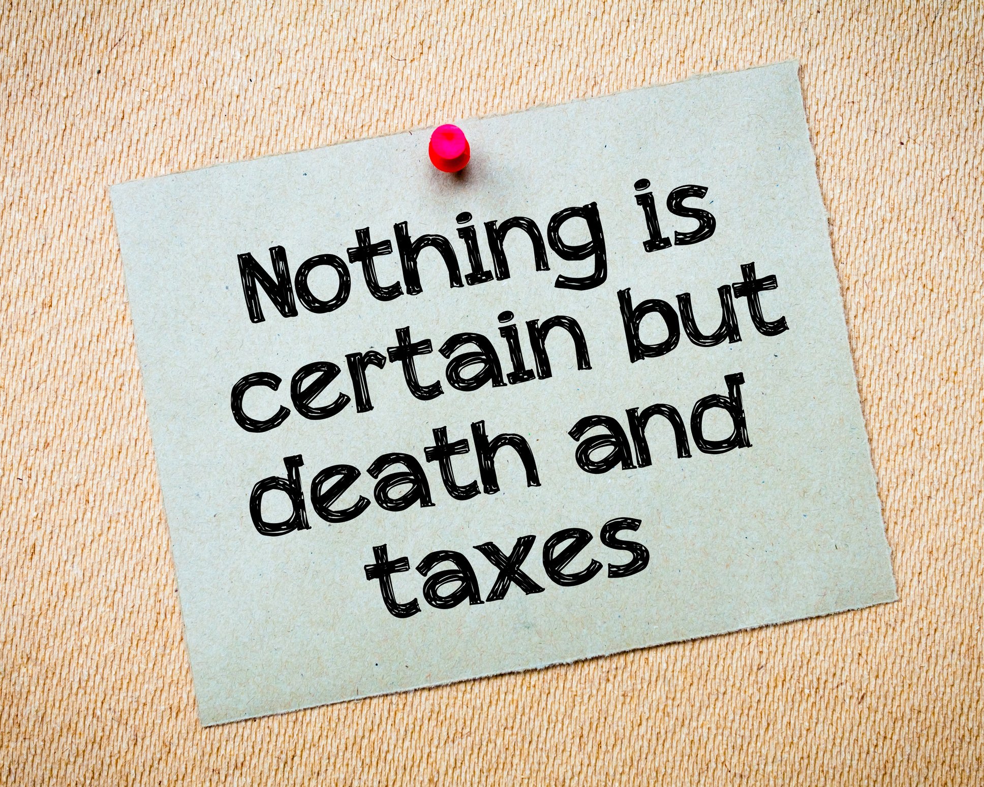 A sign reading "nothing is certain but death and taxes"