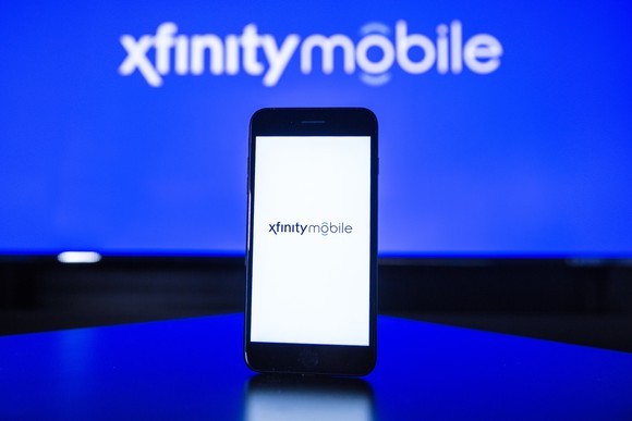 Xfinity Mobile logo on a smartphone.