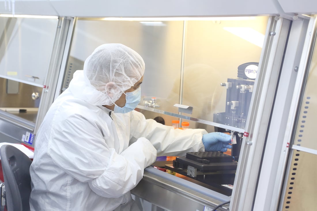 Organovo technician printing 3D human tissues.