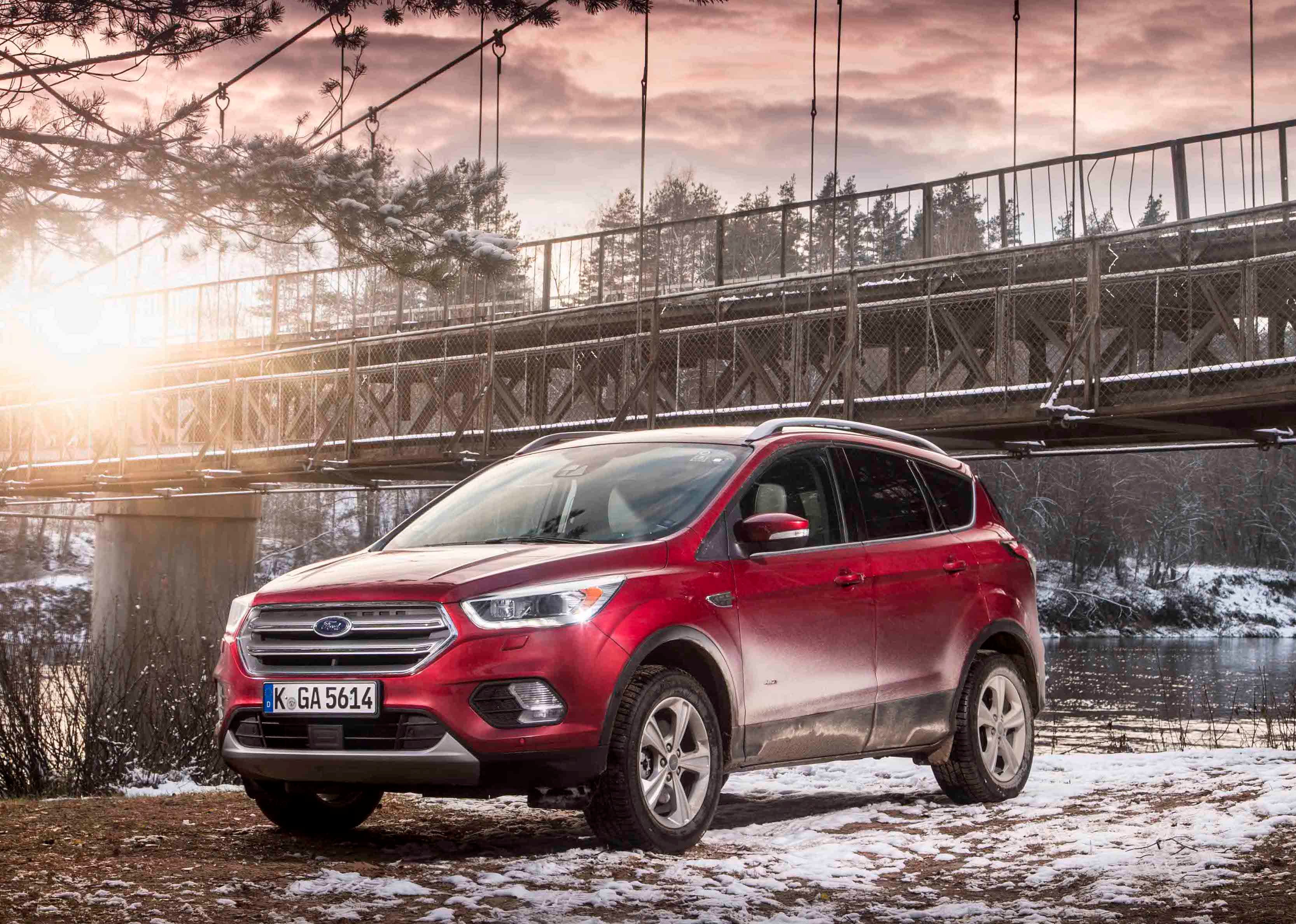 A red Ford Kuga SUV. 