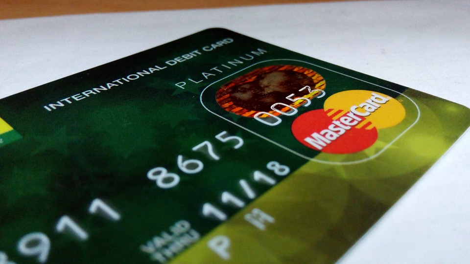 Credit card with Mastercard logo prominently displayed.