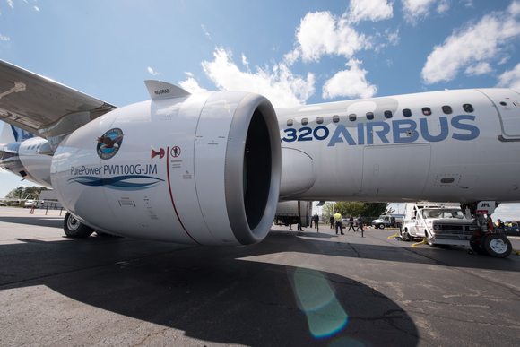 A close-up of an Airbus A320neo aircraft on the ground.