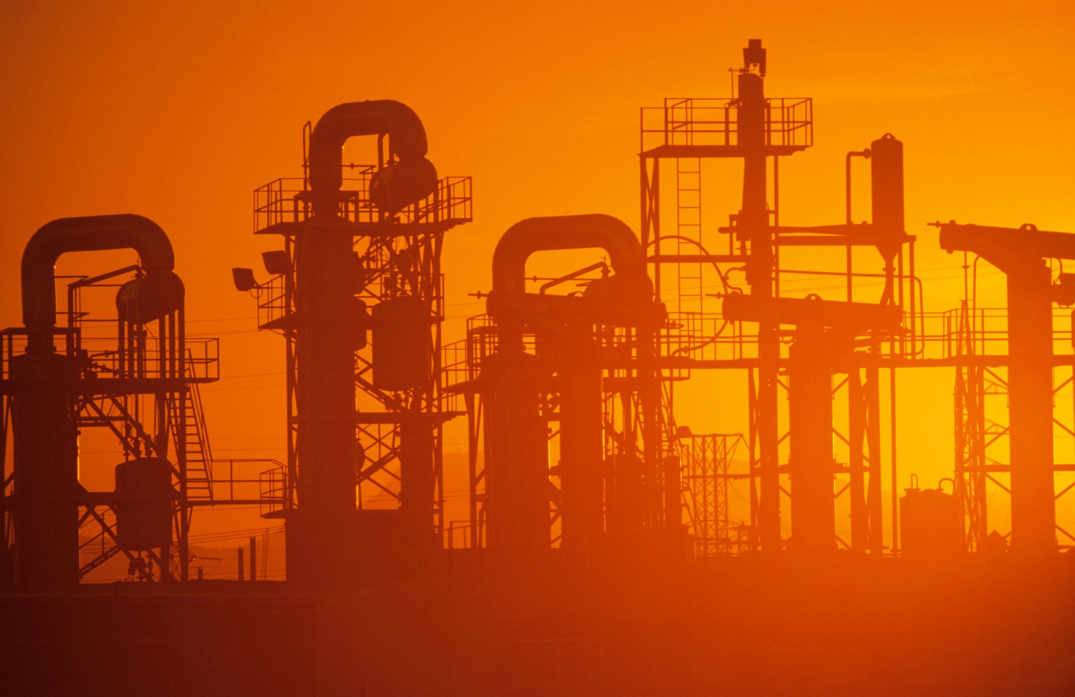 Oil refinery at sunset