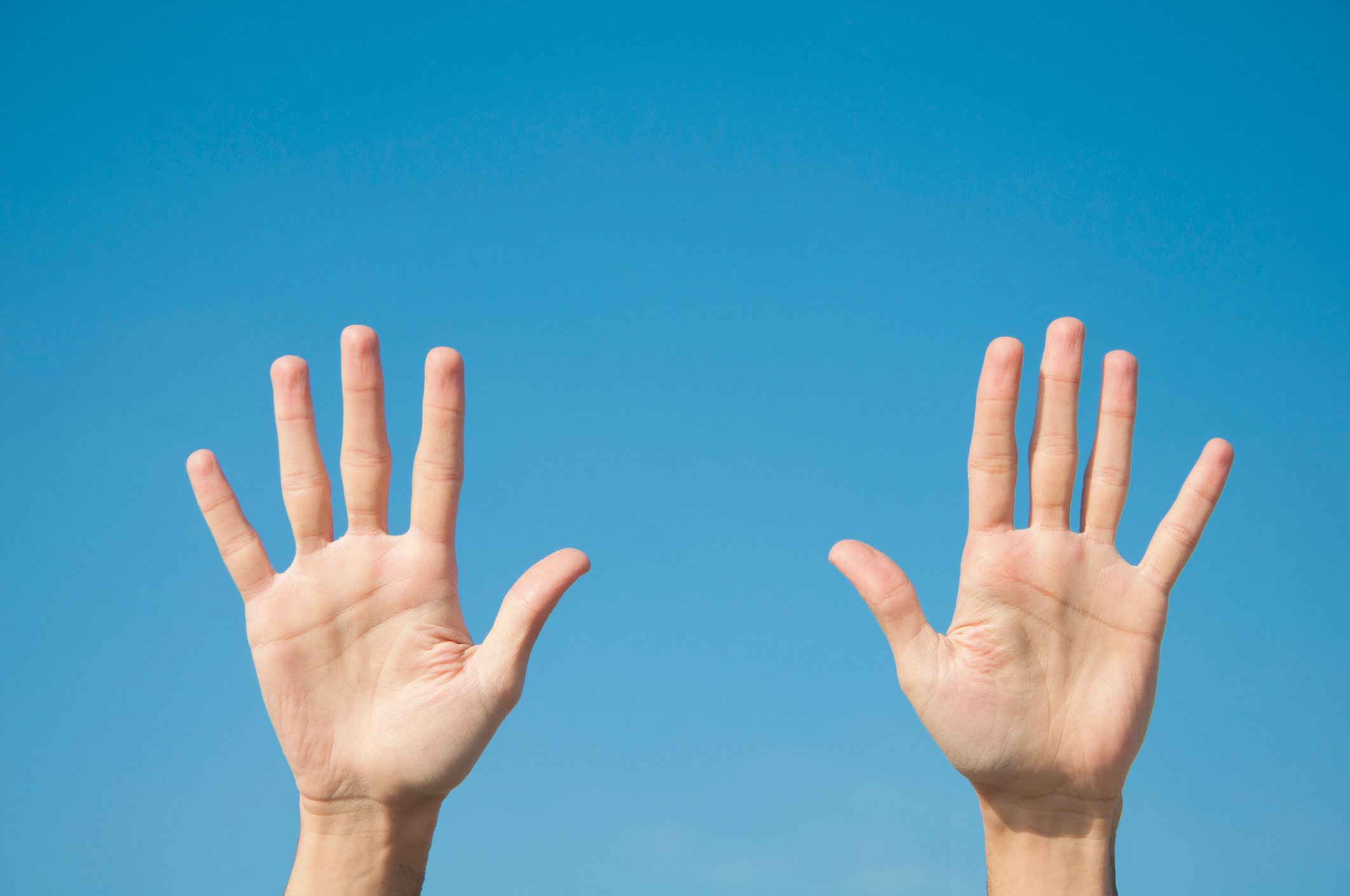 Two hands with all ten fingers spread
