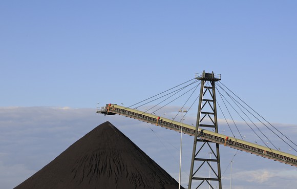 Australia met coal production being piled up and waiting for loading onto a barge.
