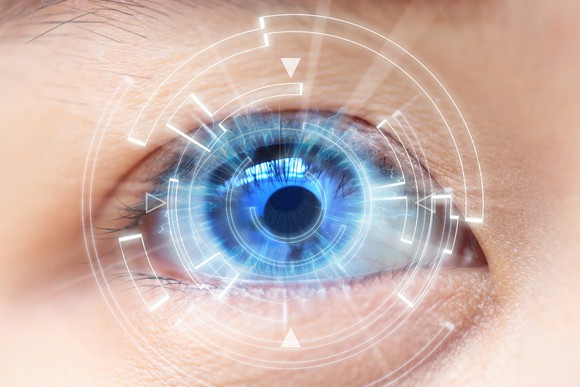 Closeup of blue eye with contact lens and computer-generated graphics