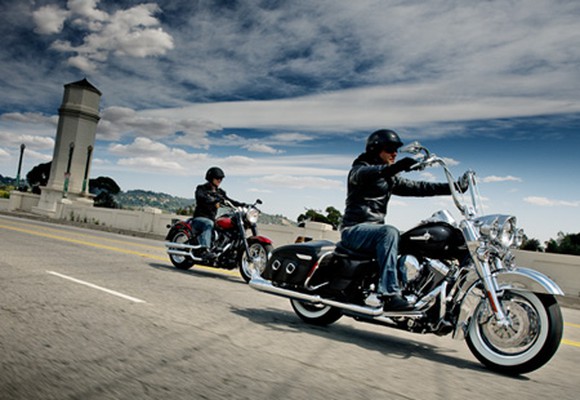 Two Harley-Davidson motorcycles on the open road