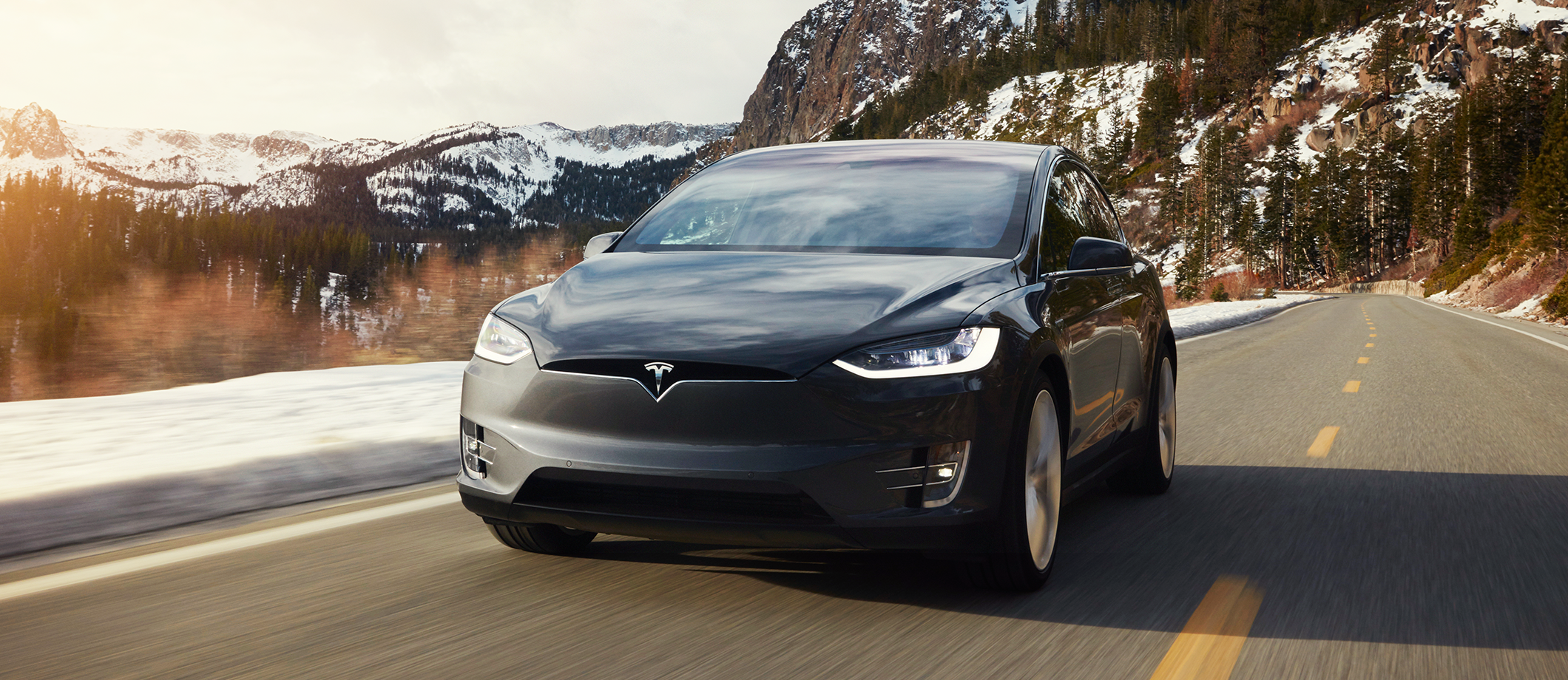 Model X driving on a mountain road