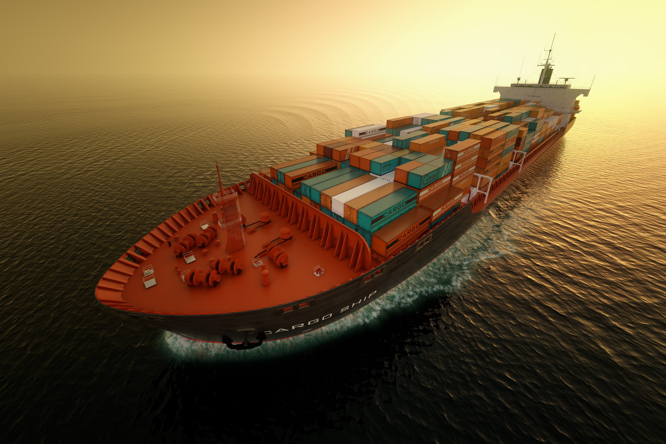 Cargo ship on open water at dusk.