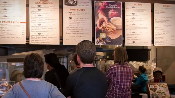An interior shot of a Panera counter with the full menu.