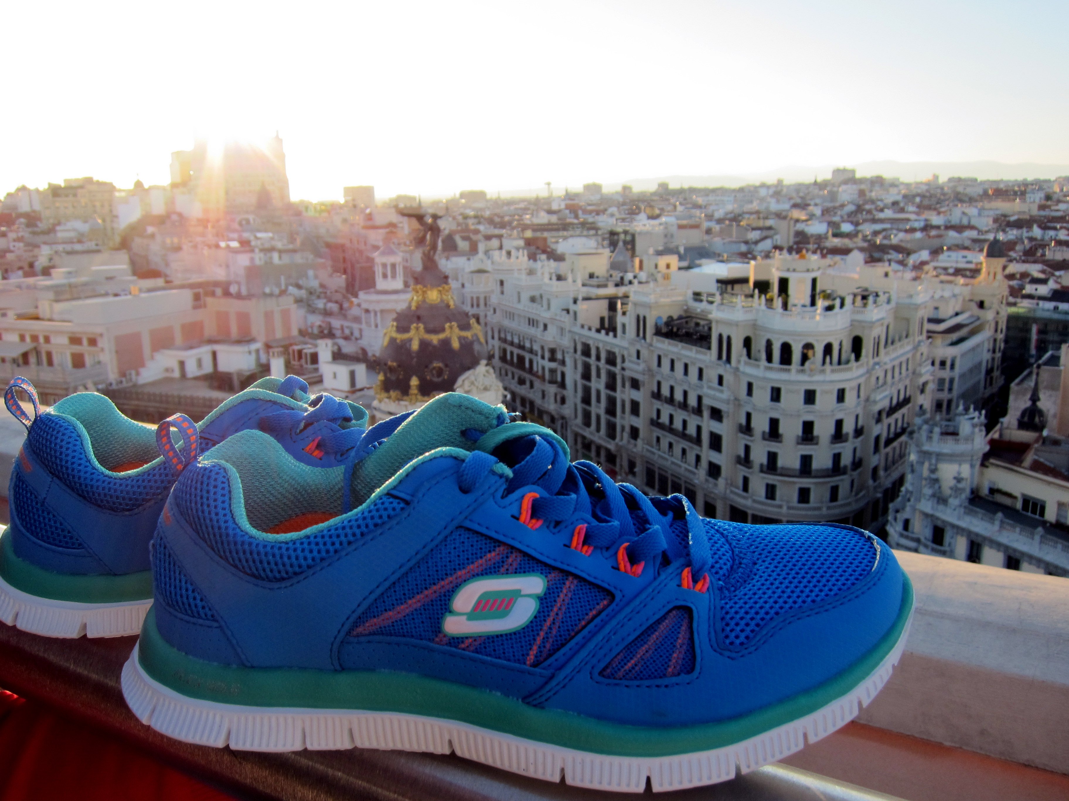 A pair of Skechers shoes overlooking the skyline in Spain.