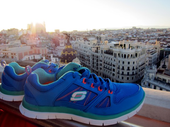 A pair of Skechers shoes overlooking the skyline in Spain.