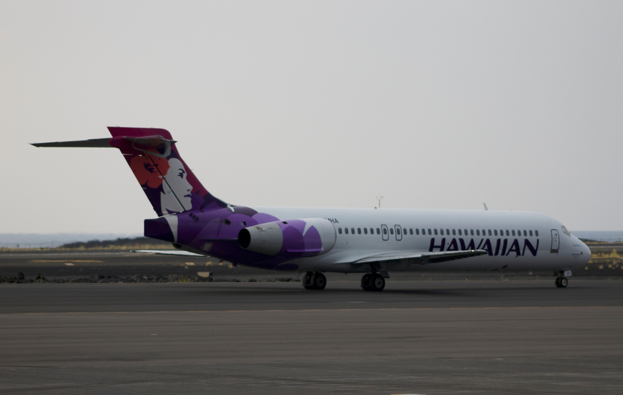 A Hawaiian Airlines plane on a runway