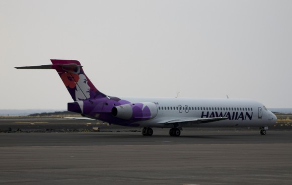 A Hawaiian Airlines plane on a runway