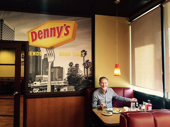 A photo uploaded by Netflix's CEO to Facebook, enjoying a steak dinner at Denny's.