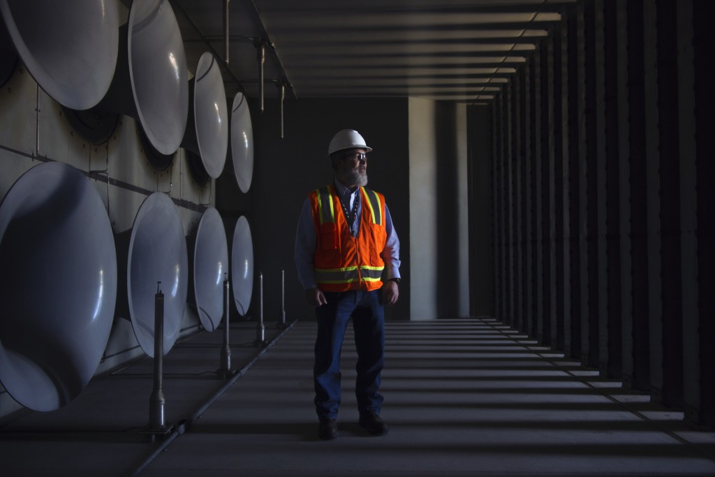 A man in a GE gas-turbine testing facility