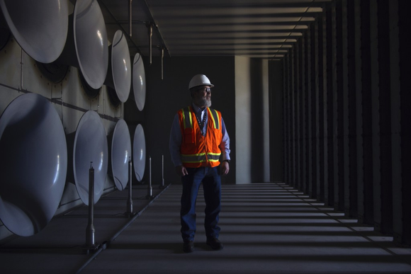 A man in a GE gas-turbine testing facility