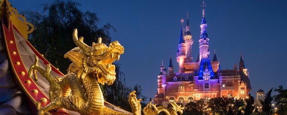 Nighttime view of a castle at Shanghai Disney park.