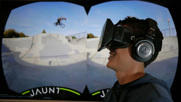 Young man with headset viewing a VR scene.