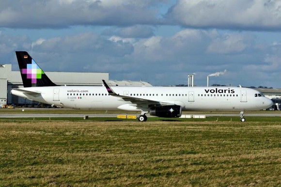 A Volaris plane on the ground.