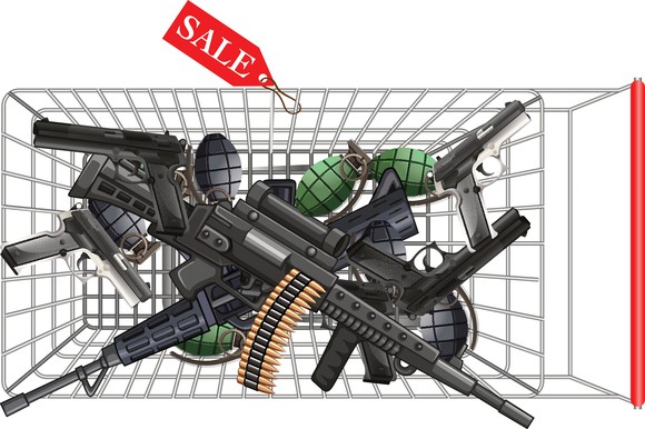 Overhead view of a shopping car full of guns.
