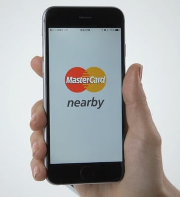 A smartphone user making mobile payment with MasteCcard. 