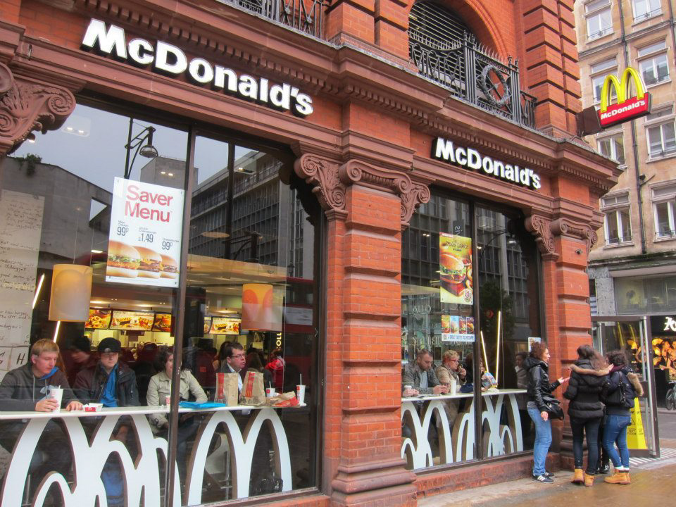 A McDonald's restaurant on a street corner